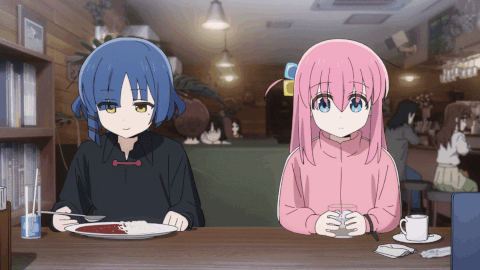 ryou yamada enjoying curry while bocchi sits awkwardly next to her