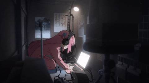 bocchi in a dark room, hunched over her laptop typing intensly.