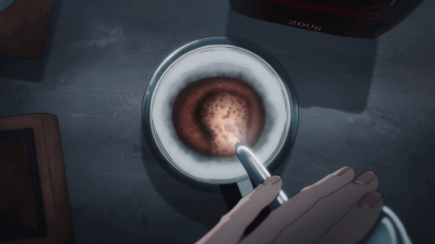 a hand pouring water over a pour over coffee maker, then a view of the caraffe as coffee drips down